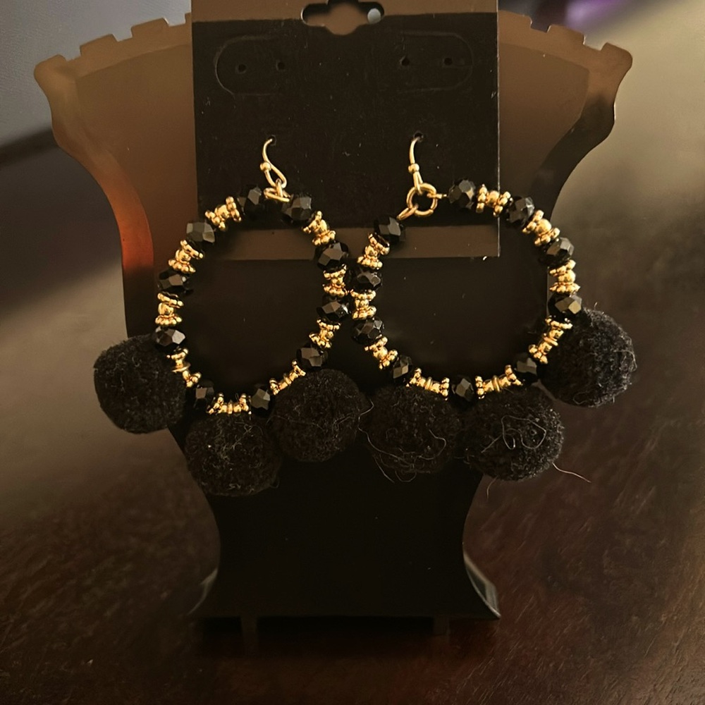 Fashion earrings. Black and gold.  Hoop with fish hook